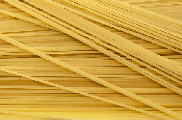 Fideos espaguetis o pasta fondo alimenticio — Foto de Stock