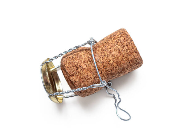 Wooden cork and muselet - wire bridle holding cork on sparkling and fizzy wines isolated on white background