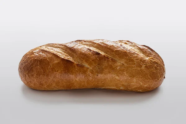 Pão Caseiro Com Uma Crosta Dourada Coberto Com Pequenas Rachaduras — Fotografia de Stock