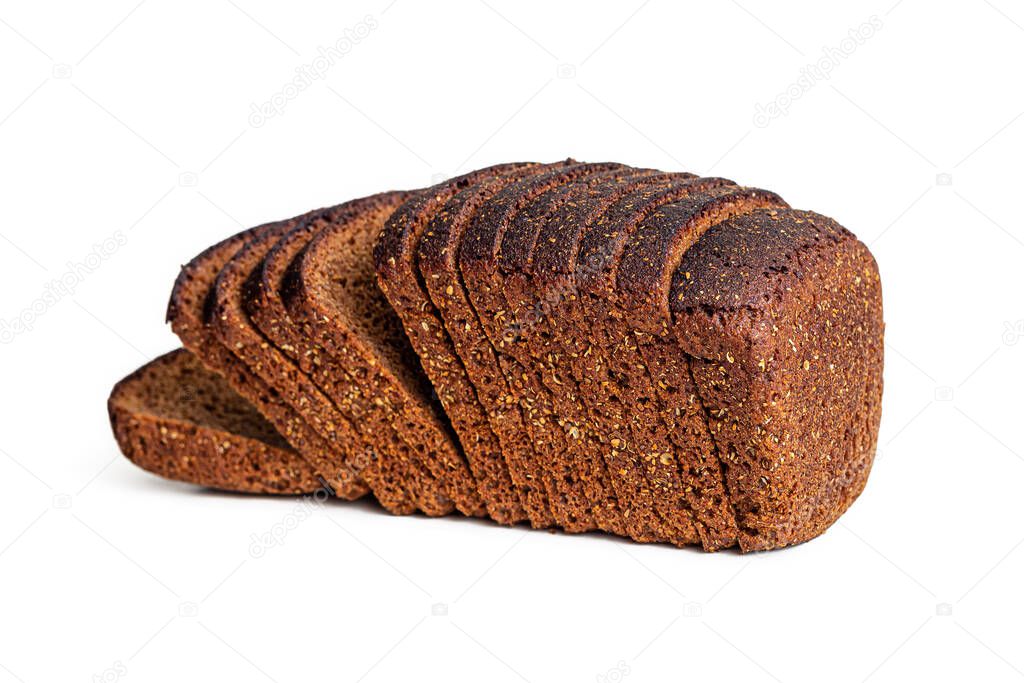 Cut into pieces a loaf of black borodino bread, made of rye flour with seeds, isolated on a white background. Side view