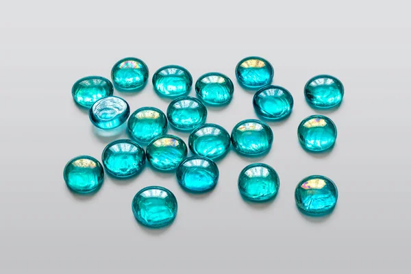 Beautiful Transparent Glass Beads Delicate Turquoise Color Light Gray Background — Stock Photo, Image