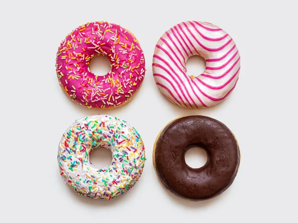Donuts Con Azúcar Glaseado Multicolor Salpicaduras Multicolores Aislados Sobre Fondo — Foto de Stock