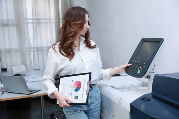 Woman printing documents in typography