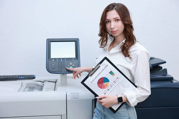 Woman printing documents in typography