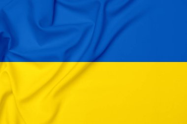 Ukrayna bayrağı renginde pürüzsüz, zarif, soyut bir arka plan. Tekstil arka planı. Kumaş duvar kağıdı. Grafik tasarım ögesi