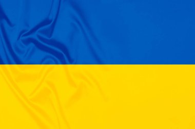 Ukrayna bayrağı renginde pürüzsüz, zarif, soyut bir arka plan. Tekstil arka planı. Kumaş duvar kağıdı. Grafik tasarım ögesi