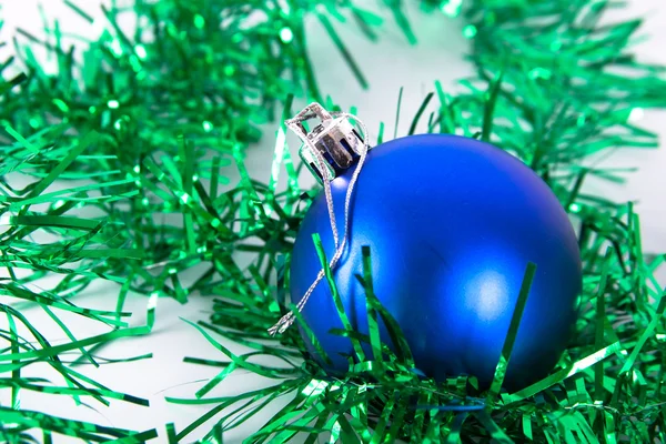 Blue christmas ball with tinsel — Stock Photo, Image