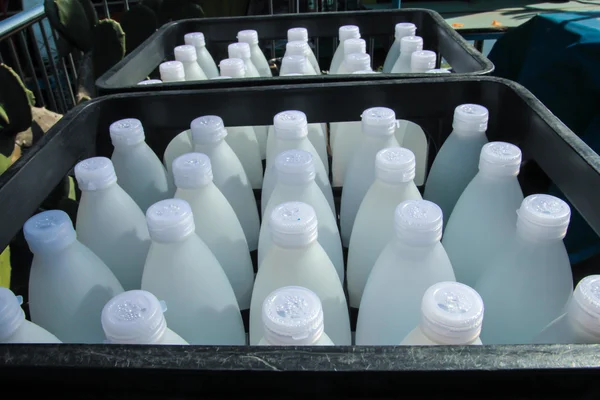 stock image White plastic water bottles in crates.