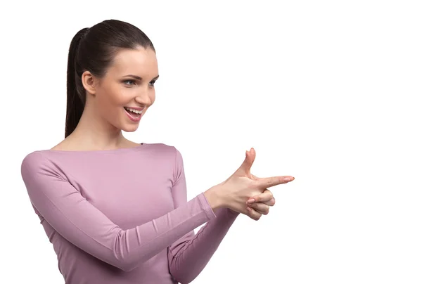 Young woman making a gun from fingers — Stock Photo, Image