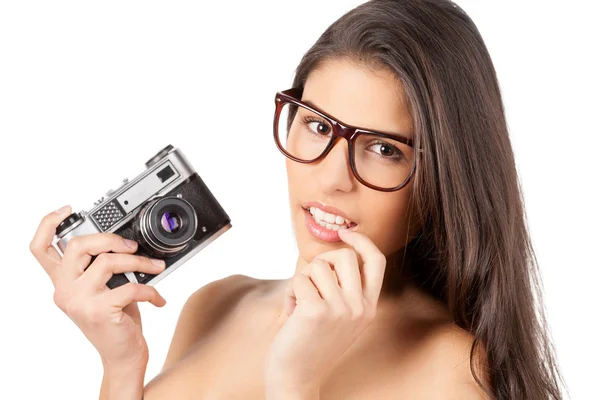 Young shirtless woman holding camera — Stock Photo, Image