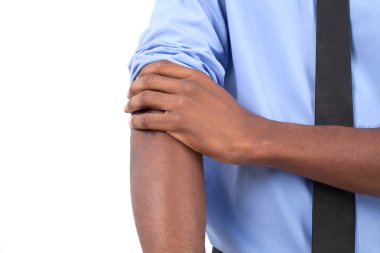 Black man in shirt and tie adjusting his sleeves clipart