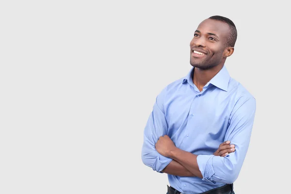 African man keeping arms crossed and looking away — Stock Photo, Image