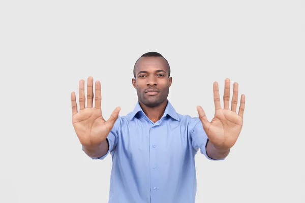 Young black man stretching out his hands — Stock Photo, Image