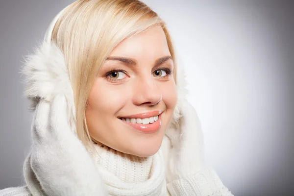 Woman in white gloves smiling at camera — Stock Photo, Image