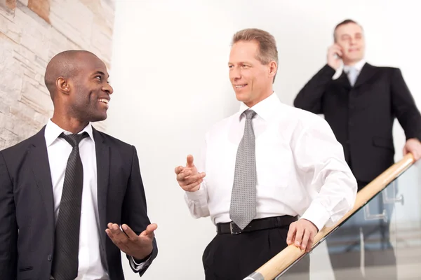 Business people on staircase — Stock Photo, Image