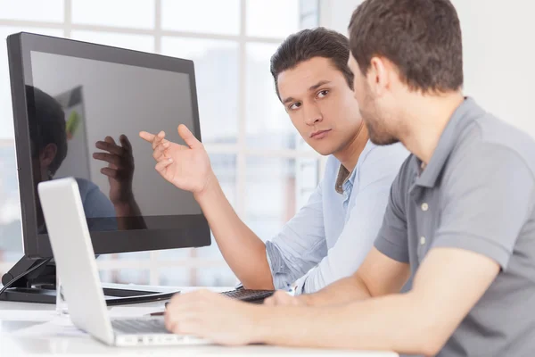 Two confident young men discussing something — Stock Photo, Image