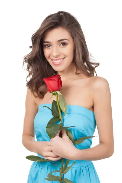 Beautiful young woman holding a red rose — Stock Photo, Image