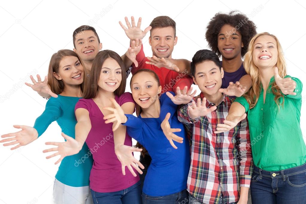 Multi-ethnic people standing close to each other and gesturing