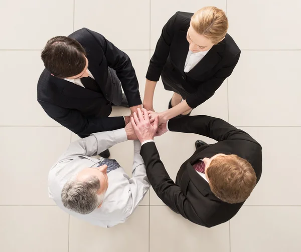 Top view of four people in formalwear — Stock Photo, Image