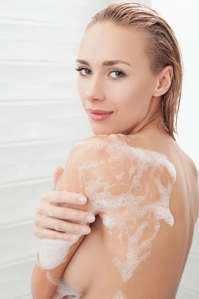 Soapy lather on beautiful body. — Stock Photo, Image