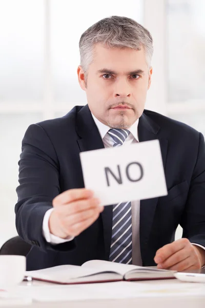 Man in formalwear holding a paper with no sign — Stock Photo, Image