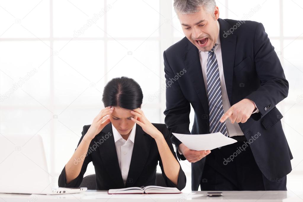 Businessman holding document and shouting