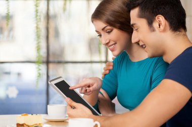 Couple with digital tablet. clipart