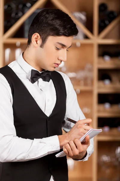 Waiter making notes. — Stock Photo, Image