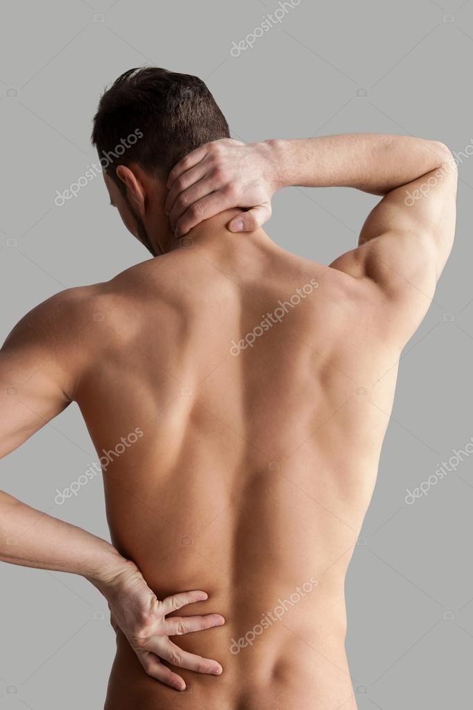 Always in good shape. Cropped image of muscular man measuring his waist  with measuring tape Stock Photo by gstockstudio