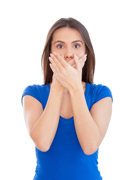 Woman covering mouth with hands — Stock Photo, Image