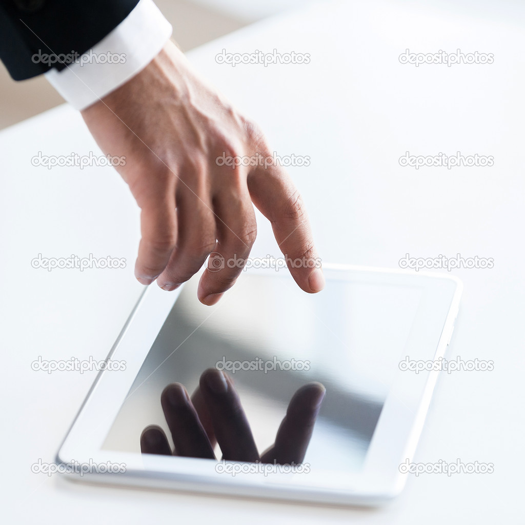 Hand touching a screen