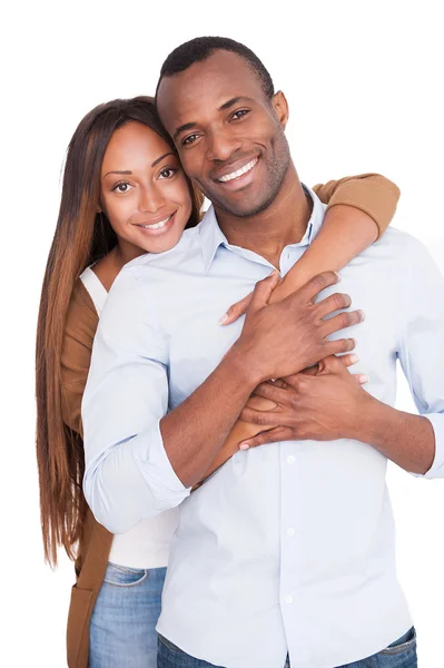 Beautiful young African woman hugging her boyfriend — Stock Photo, Image