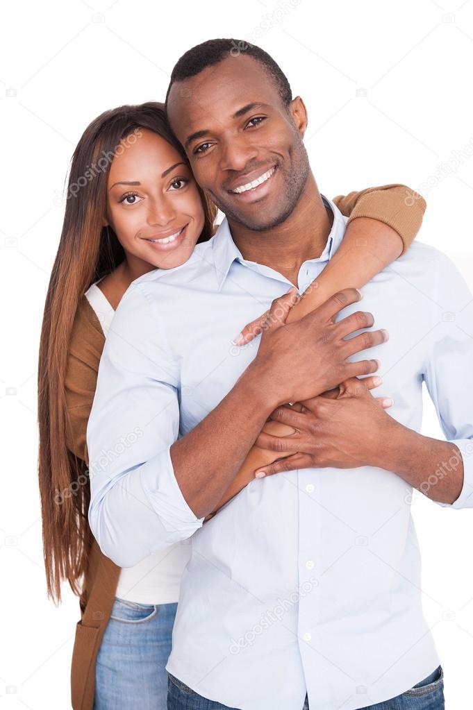 Beautiful young African woman hugging her boyfriend