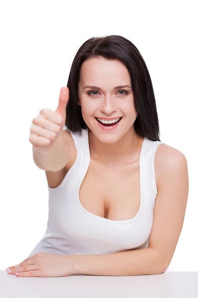 Woman with beautiful cleavage gesturing and smiling — Stock Photo, Image