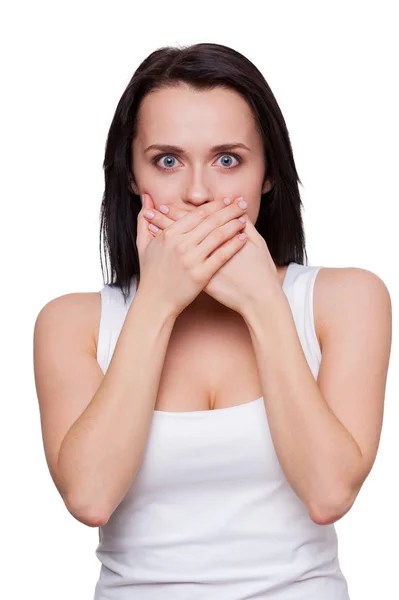 Woman covering mouth with hands and looking at camera — Stock Photo, Image