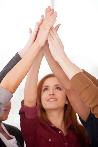 Group of people standing close to each other and holding hands — Stock Photo, Image