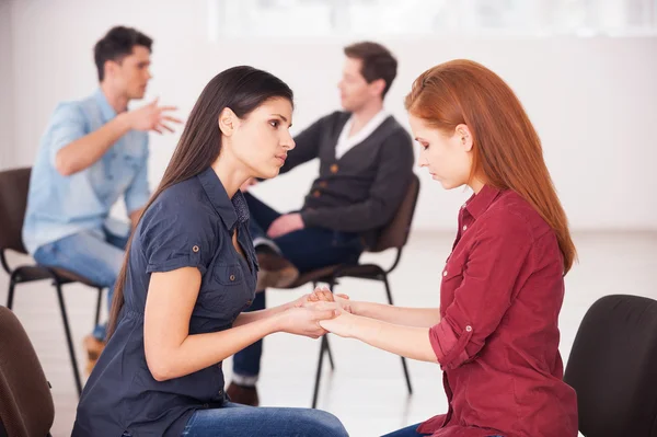 Two depressed women helping each other to solve problems â Stock Photo
