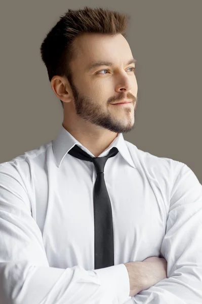 Man in formalwear keeping arms crossed and looking away — Stock Photo, Image