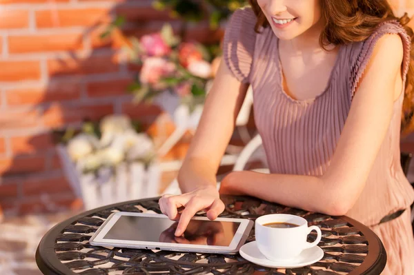 Cropped image of woman working on digital tablet — Stock Photo, Image