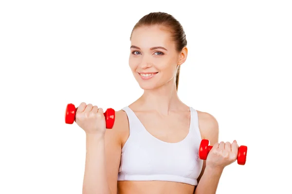 Woman exercising with dumbbells — Stock Photo, Image