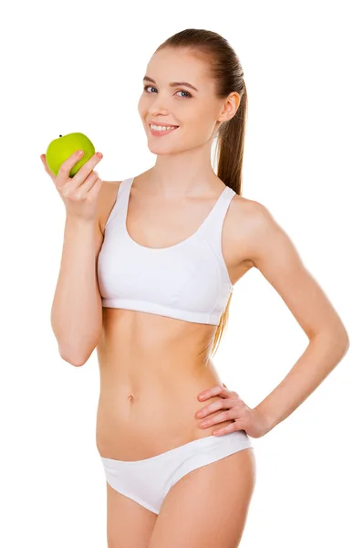 Woman in white bra and panties holding one hand on hip and pointing you — Stock Photo, Image