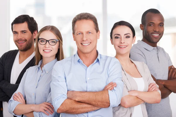 Group of business people keeping arms crossed — Stock Photo, Image