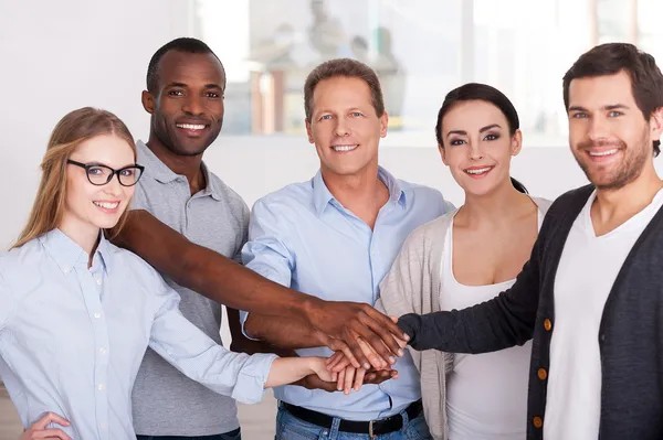 Business people holding hands together — Stock Photo, Image