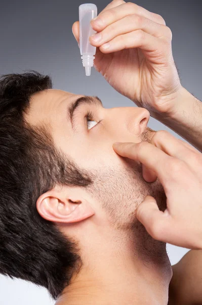 Taking care of his eyes. — Stock Photo, Image