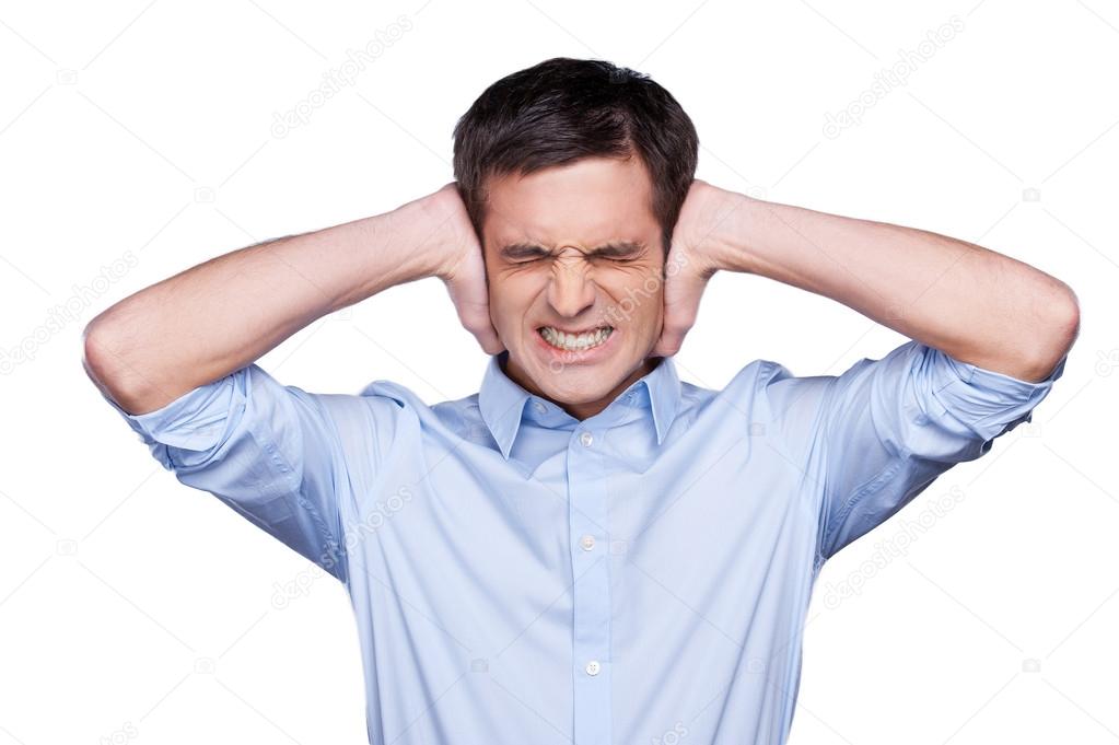 Man covering ears with hands
