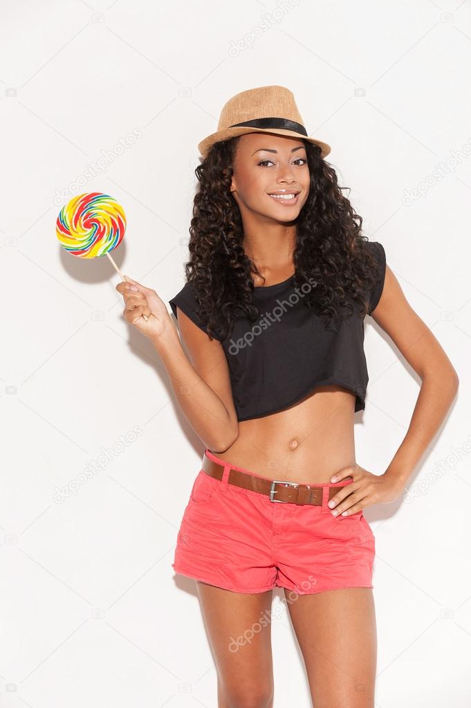 African womanholding a big lollipop