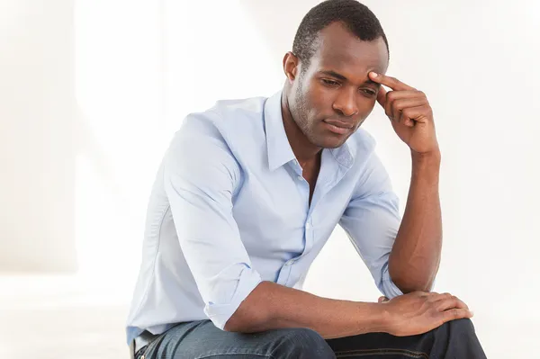 Thoughtful young African man — Stock Photo, Image