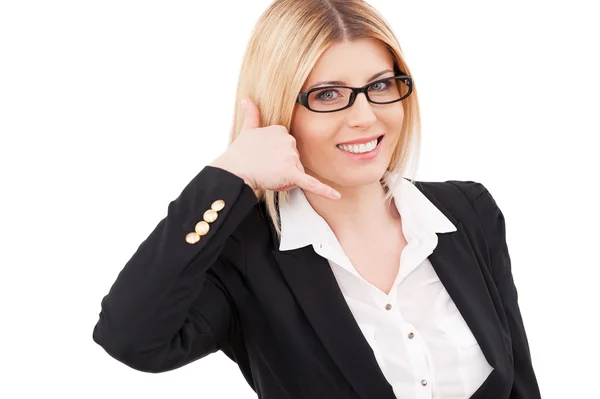 Businesswoman gesturing phone sign — Stock Photo, Image