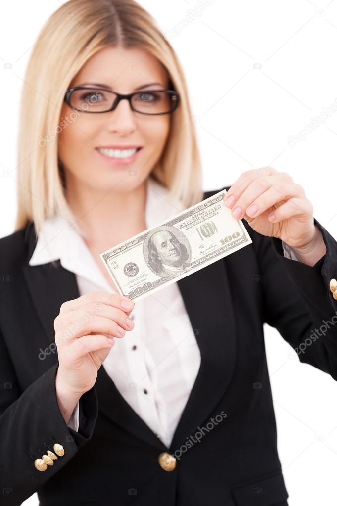 Businesswoman stretching out hands with one hundred dollar bill