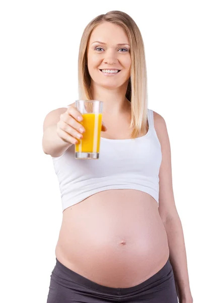 Pregnant woman stretching out a glass — Stock Photo, Image